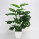 Grande pianta artificiale philo leaves verde in vaso bianco.